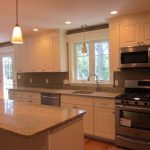 White cupboards with white/gray counter top